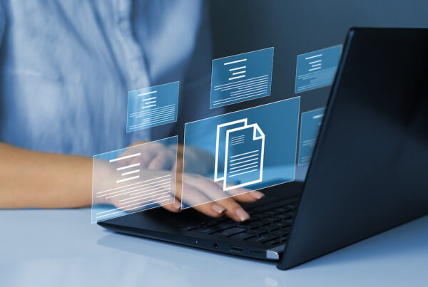 Online documentation database and document management system concept. Businesswoman working on laptop with virtual screen. Process automation to efficiently manage files.